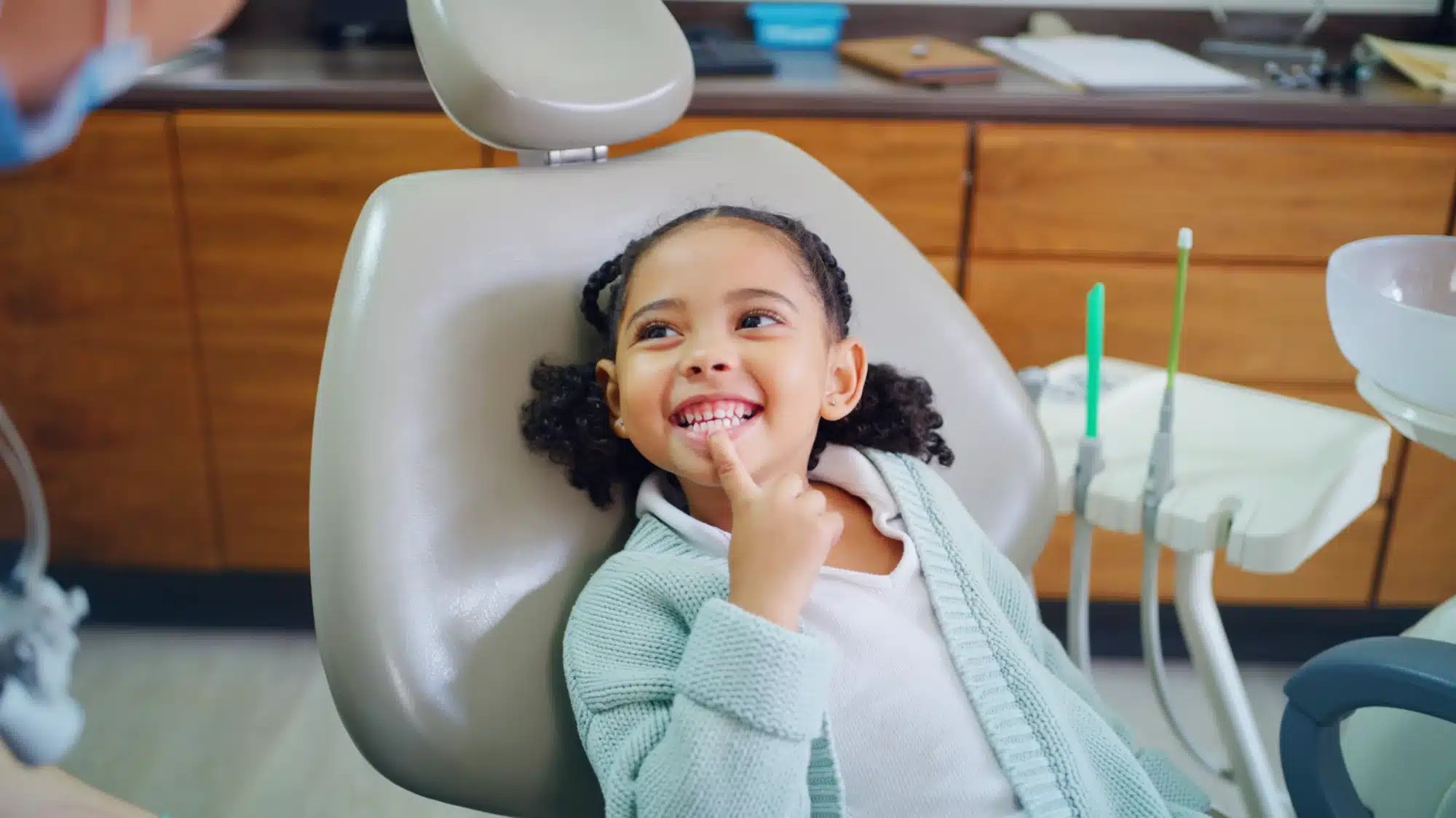 family visiting a dentist in san diego california for preventive dental care including routine checkups and cleanings for children and adults